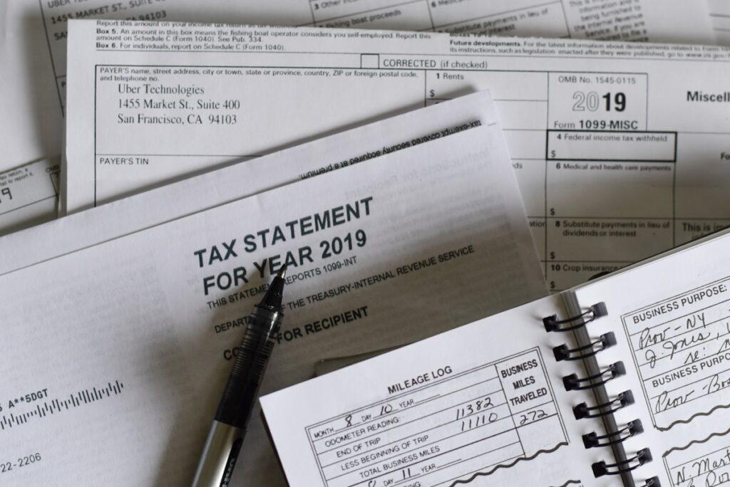 GST return filing process for small business in India documents and laptop